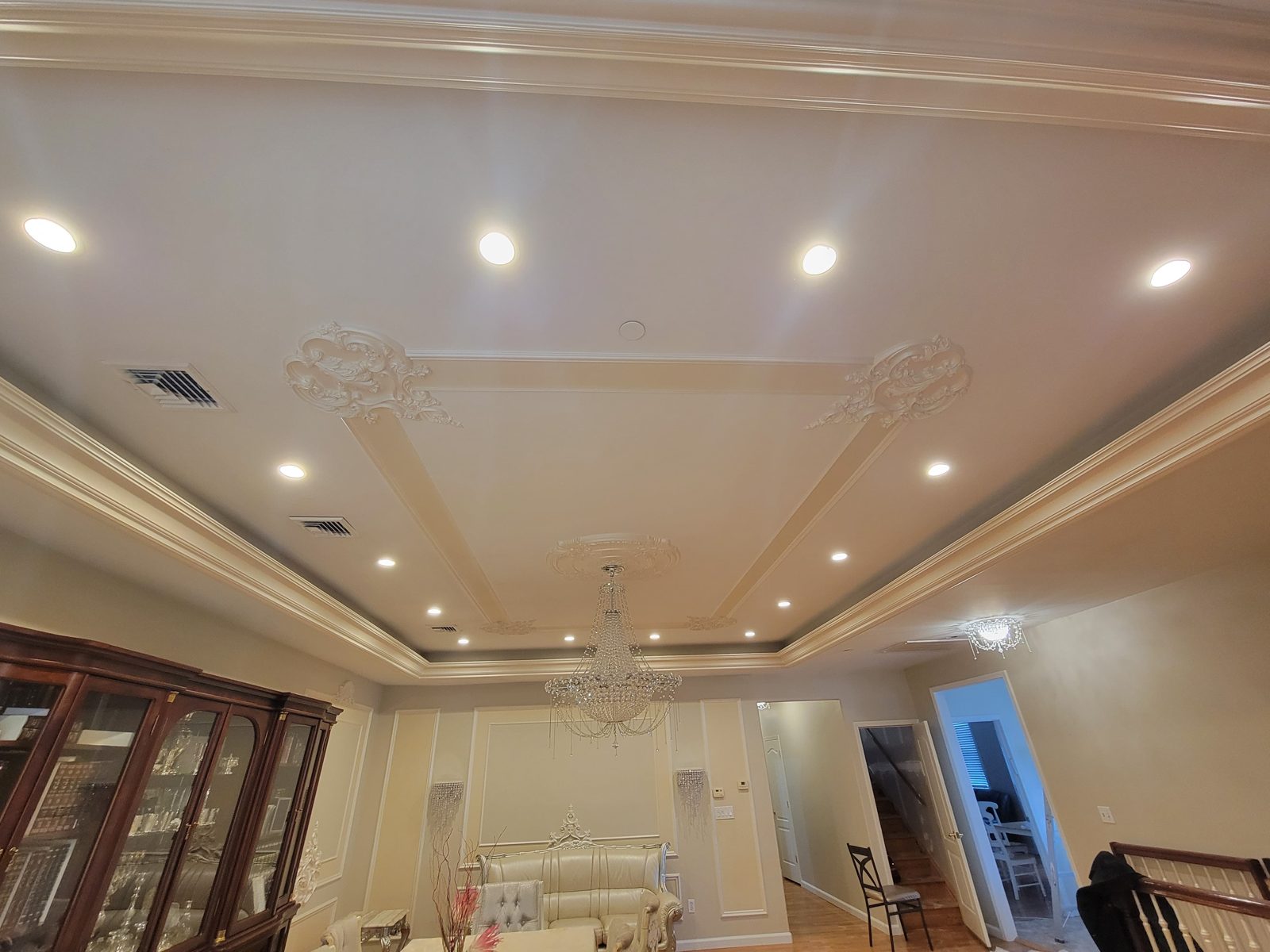 Ornate tray ceiling fitted with recessed downlights