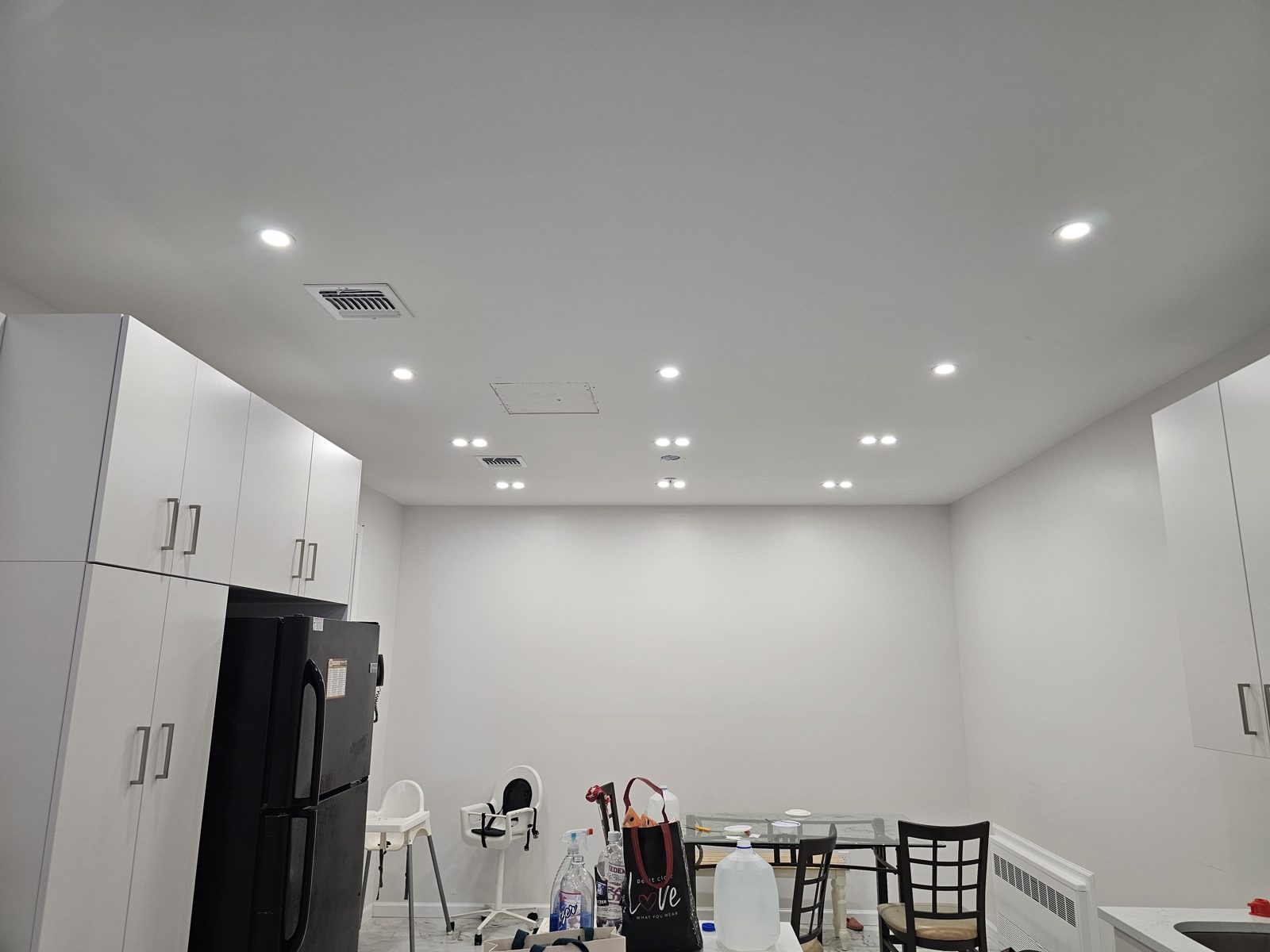 Kitchen with cabinetry and recessed downlights across the ceiling
