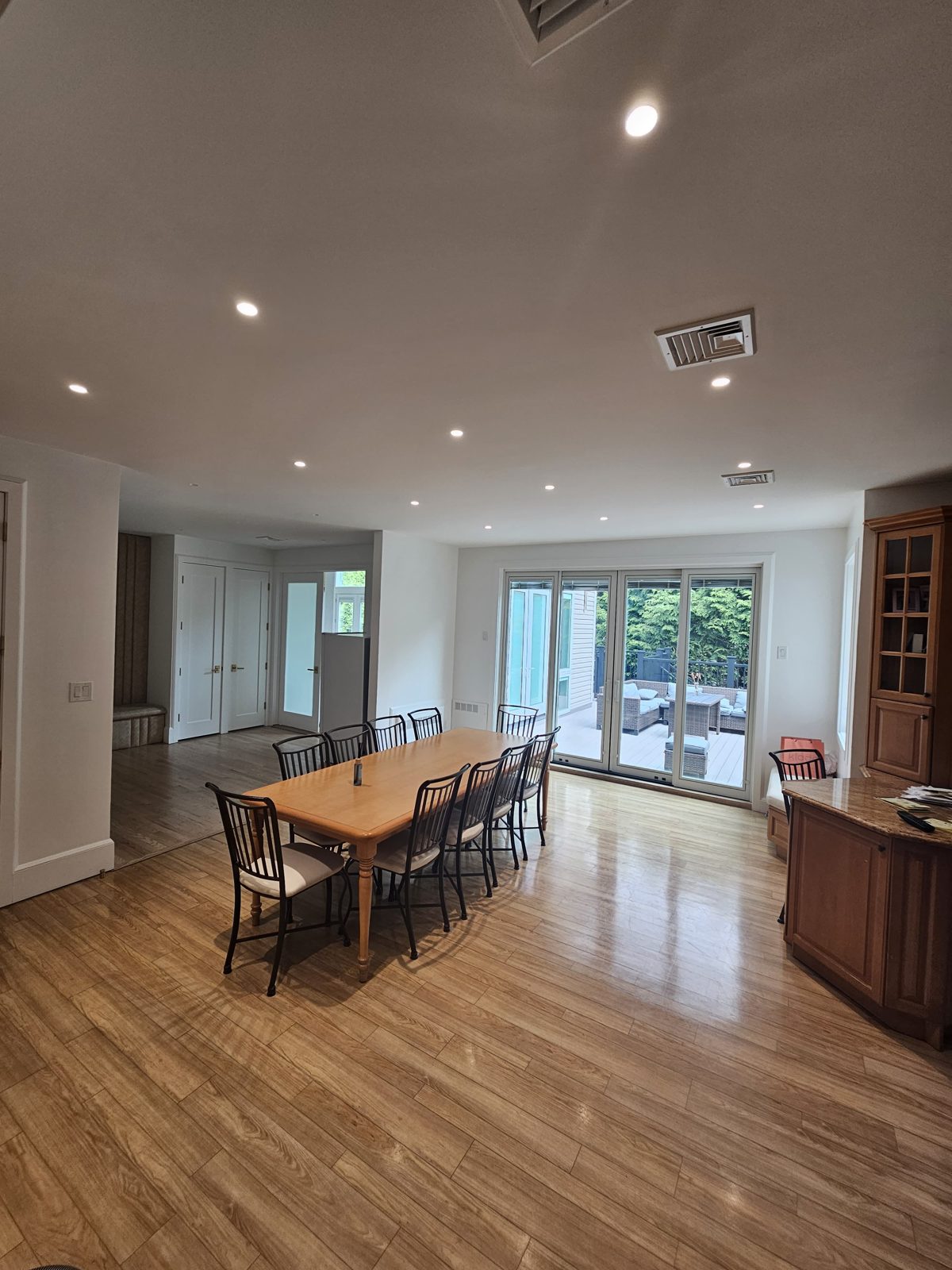 Kitchen and dining area with recessed downlights and garden doors