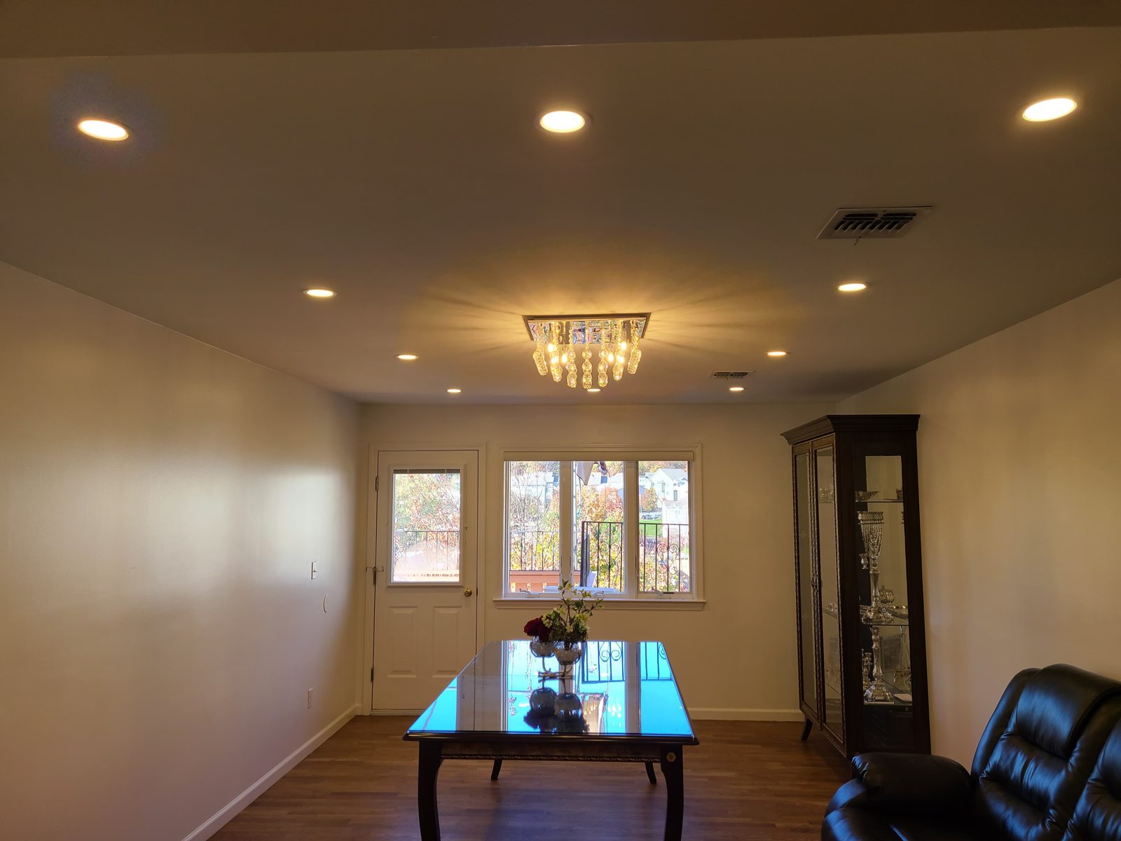 Games room with a chandelier and recessed downlights above a pool table
